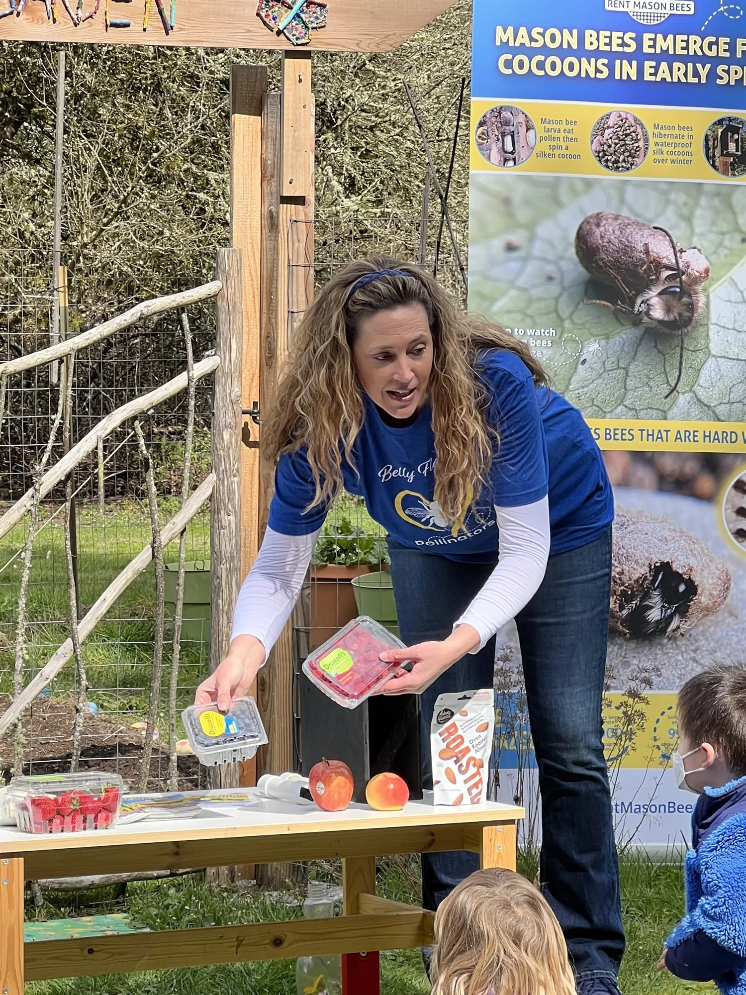 Strawberries, blueberries, and apples on an outdoor lesson table